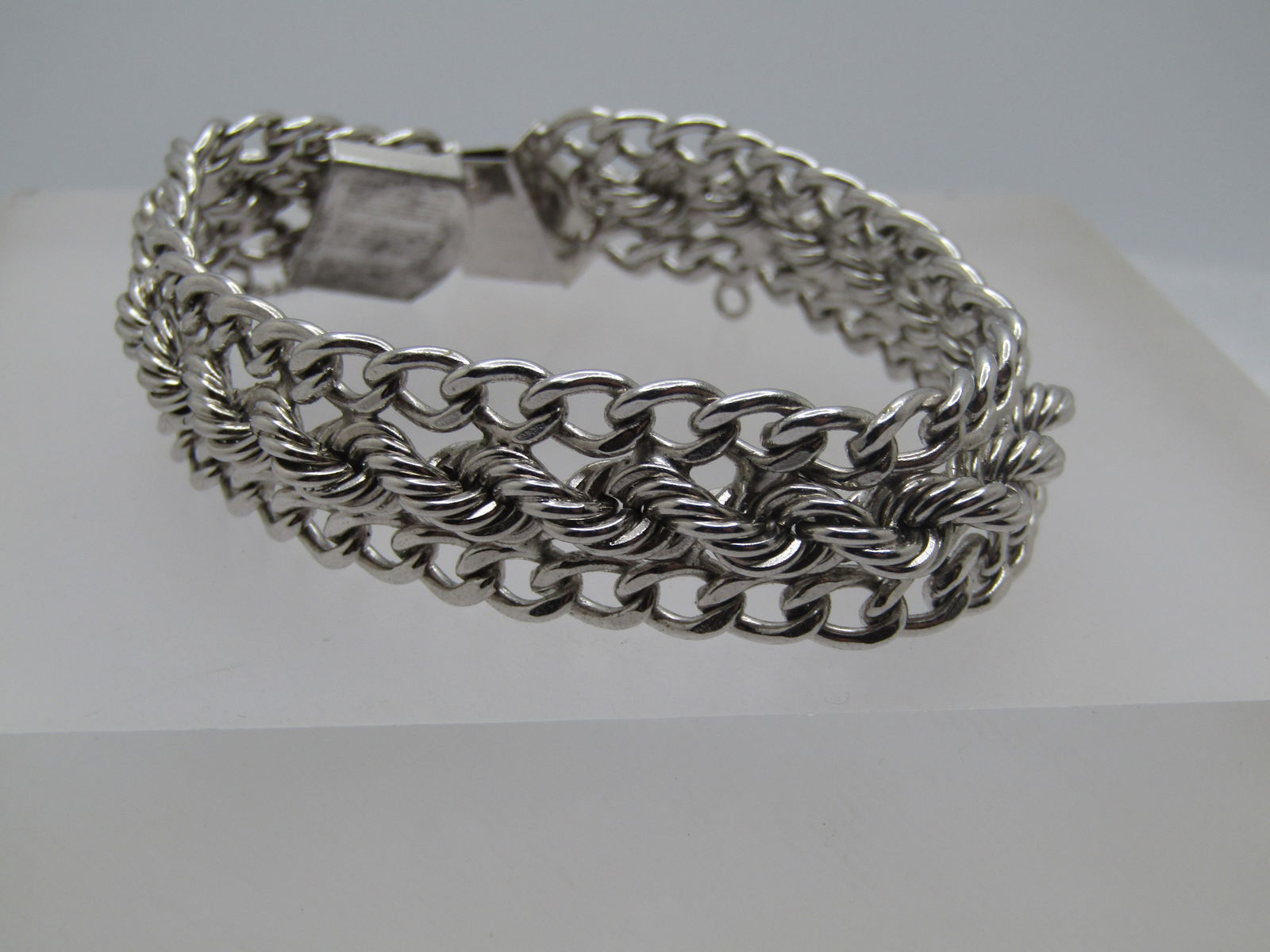 Vintage Sterling Wide Bracelet, Signed, 7.5", 1970's-1980's, Safety Chain: Vintage Sterling Wide Bracelet, Signed, 7.5", 1970's-1980's, Safety Chain. It is signed Rhythm. It is appx. 15.5mm wide. It has curb links on the edges and down the center is a heavy twisted chain tha