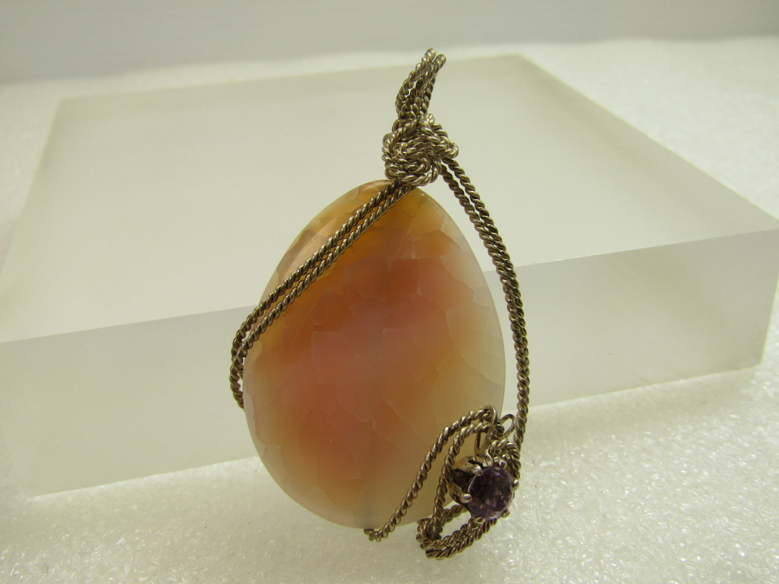 Sterling Pink Quartz Pendant with Amethyst, 1980's-1990's: Sterling Pink Quartz Pendant with Amethyst, 1980's-1990'sThis is a teardrop shaped pink quartz. It is 2.5" tall and 1.5" wide. There is a closed black appx. 6mm amethyst pront-get with closed back set