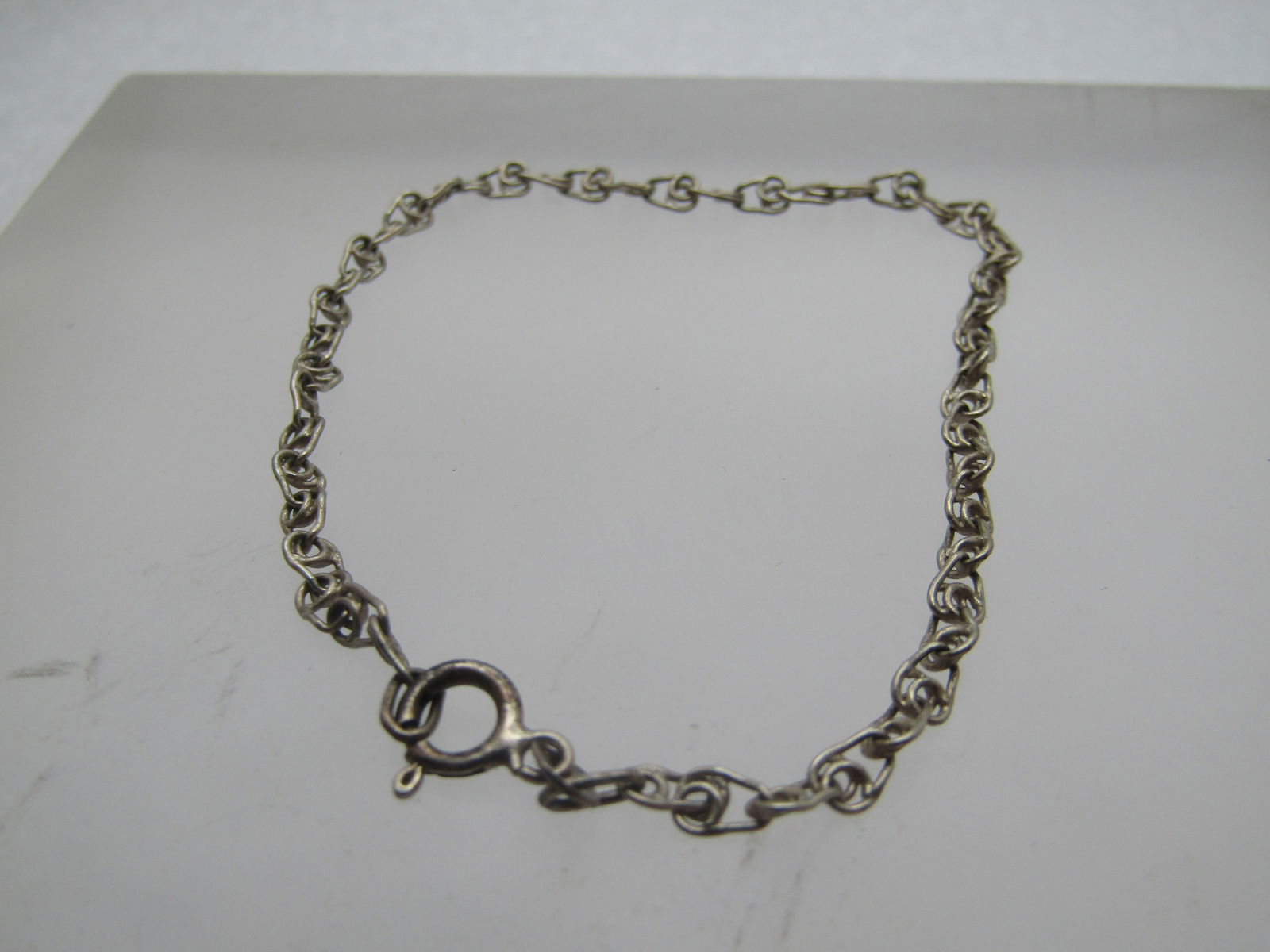 Vintage Sterling Scrolled Link Bracelet, 7.25", 1960's-1970's: Vintage Sterling Scrolled Link Bracelet, 7.25", 1960's-1970's. This is a scrolled intricate link, spring clasp where it is marked .925 and tests as sterling with a weight of appx. 2.05 gr. It is appx.