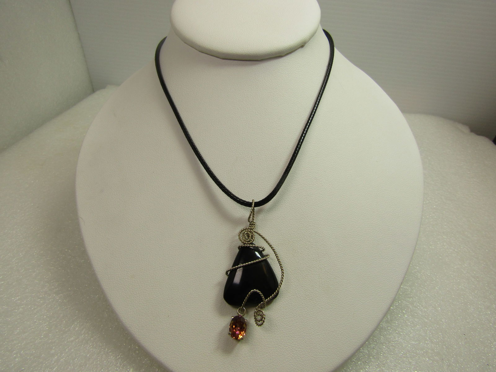 Vintage Sterling Wrapped Onyx & Topaz Necklace, 24"-26"- 1980's-1990's: Vintage Sterling Wrapped Onyx & Topaz Necklace, 24"-26"- 1980's-1990's. The onyx is a puffy triangular piece that is appx. 1" down each side - and is appx. 3.5mm thick. It has a dangling pink topaz th