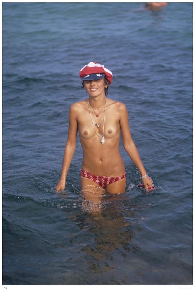Saint-Tropez Swimmer 1971 - Slim Aarons Estate Stamped: 1971 (printed later): Title: Saint-Tropez Swimmer 1971 - Slim Aarons Estate Stamped: 1971 (printed later) Description: Saint-Tropez Swimmer 1971 - Slim Aarons Estate Stamped A topless swimmer in Saint-Tropez, on the French
