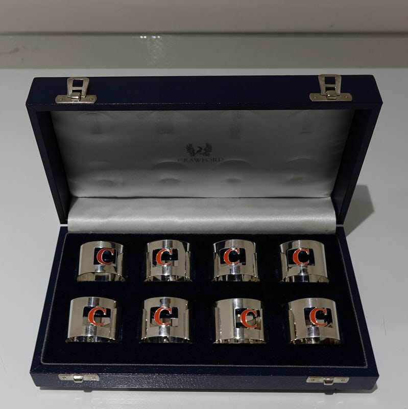 Set 8 Cased Silver & Enamelled Napkin Rings Retailed By Crawford: Title:Set 8 Cased Silver & Enamelled Napkin Rings Retailed By Crawford Description:Description A set of eight silver and enamel napkin rings presented in blue velvet lined case. The napkins are plain