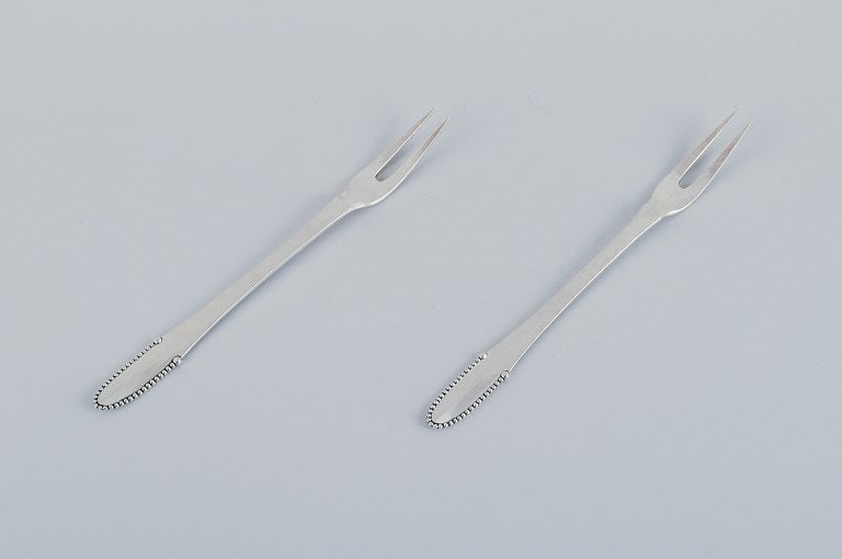 Georg Jensen Beaded. Two meat forks in 830 silver.: Title:Georg Jensen Beaded. Two meat forks in 830 silver. Description:Georg Jensen Beaded. Two meat forks in 830 silver. 1915-1930 hallmark. In excellent condition. Dimensions: L 18.2 cm. Reserve: $420