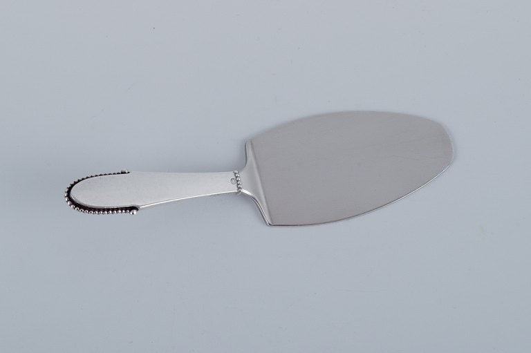 Georg Jensen Beaded. Serving spoon in sterling silver with steel blade.: Title:Georg Jensen Beaded. Serving spoon in sterling silver with steel blade. Description:Georg Jensen Beaded. Serving spoon in sterling silver with steel blade. Post-1945 hallmark. In excellent condi