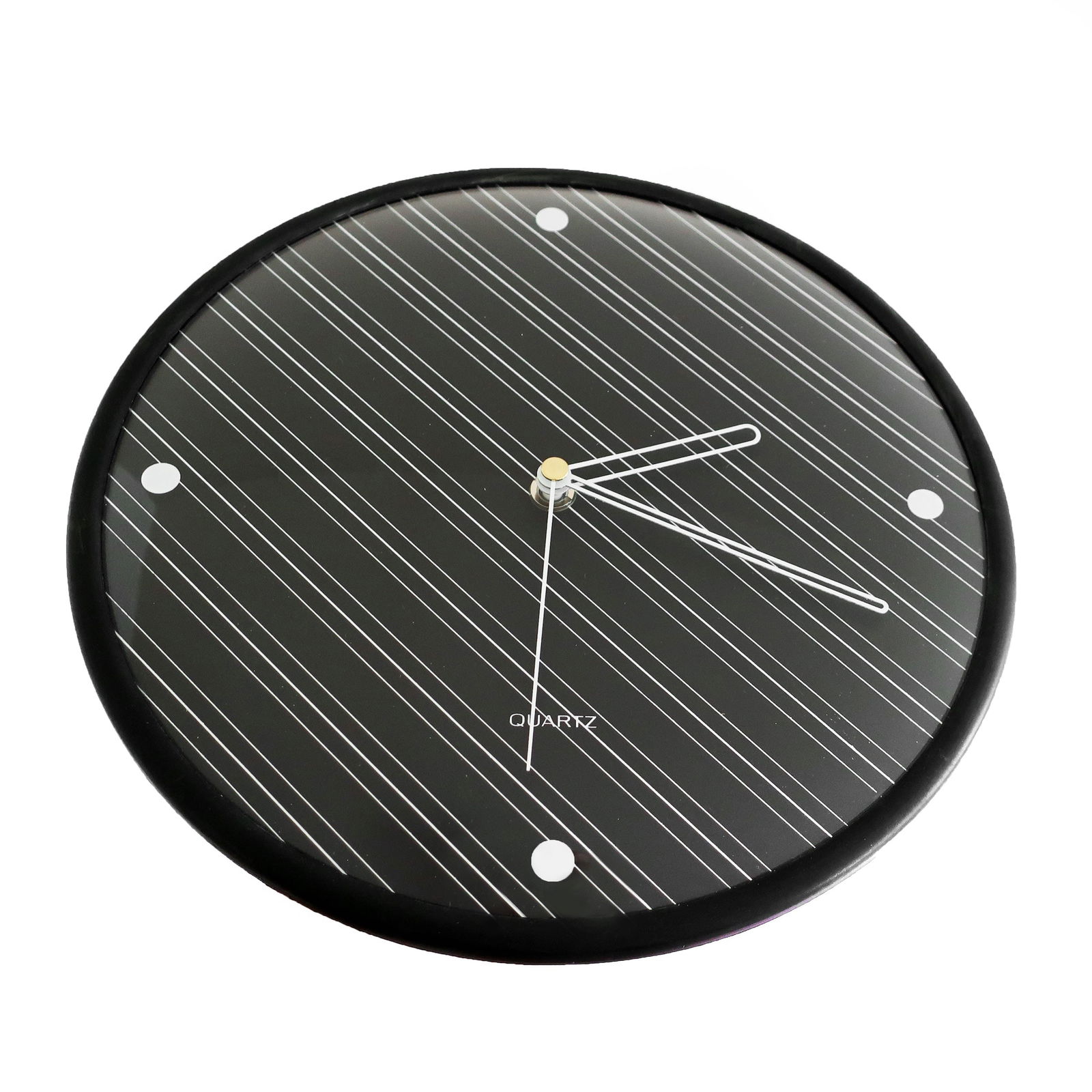 Postmodern Diagonal Pin Stripe Wall Clock by Baker Hart & Stuart: A striking 1980s black wall clock with diagonal pin stripes at a 45 degree angle and white pin stripe hands. Produced by Baker Hart & Stuart, a home goods brand for the department store chain Mervyns