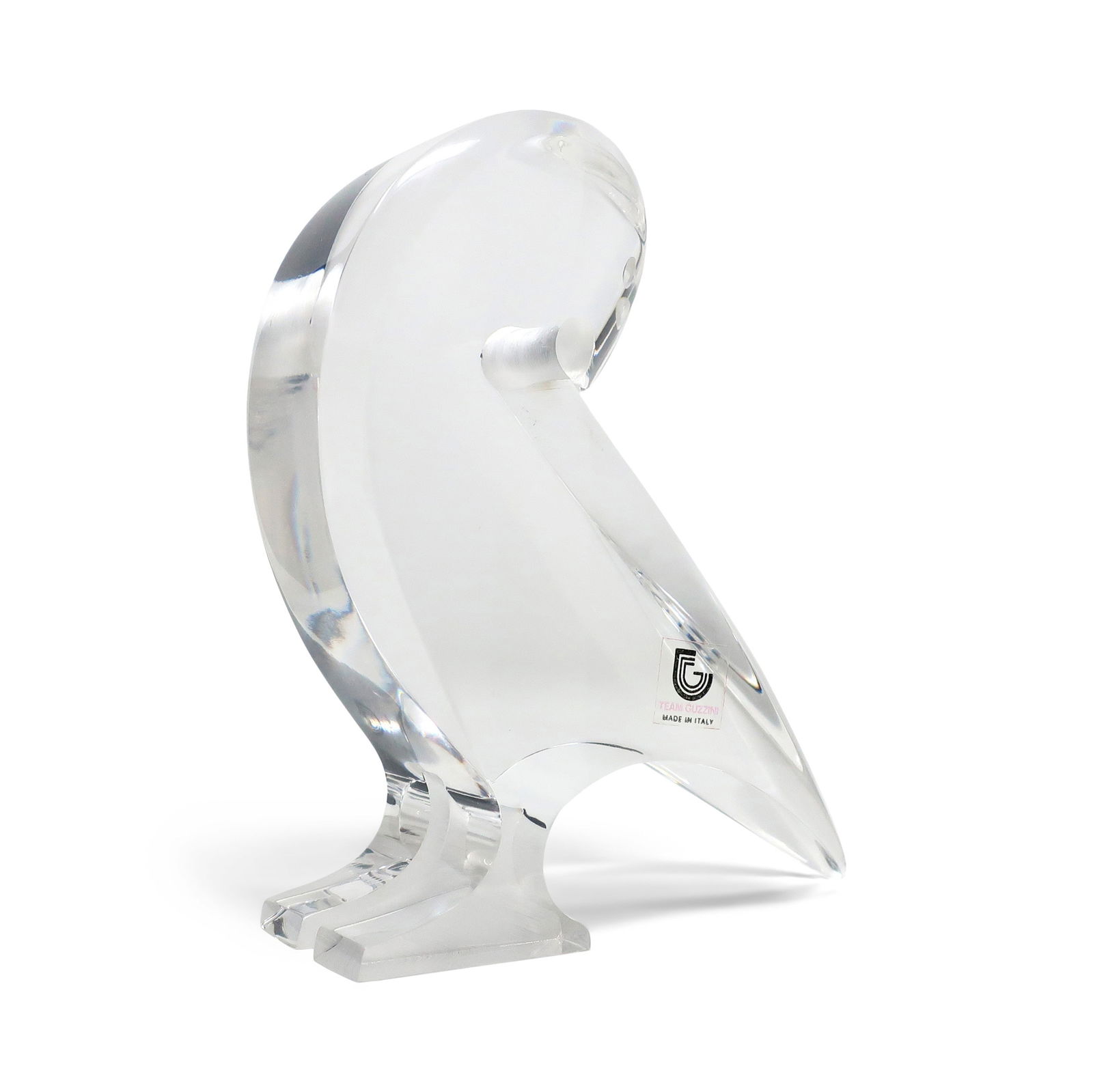Vintage Lucite Bird Sculpture by Team Guzzini: A vintage stylized bird sculpture in lucite by Tim Crea for Guzzini. In very good vintage condition with "Team Guzzini Made in Italy" sticker. 5" x 1.5" x 5" Reserve: $25.00 Shipping: Domestic: F