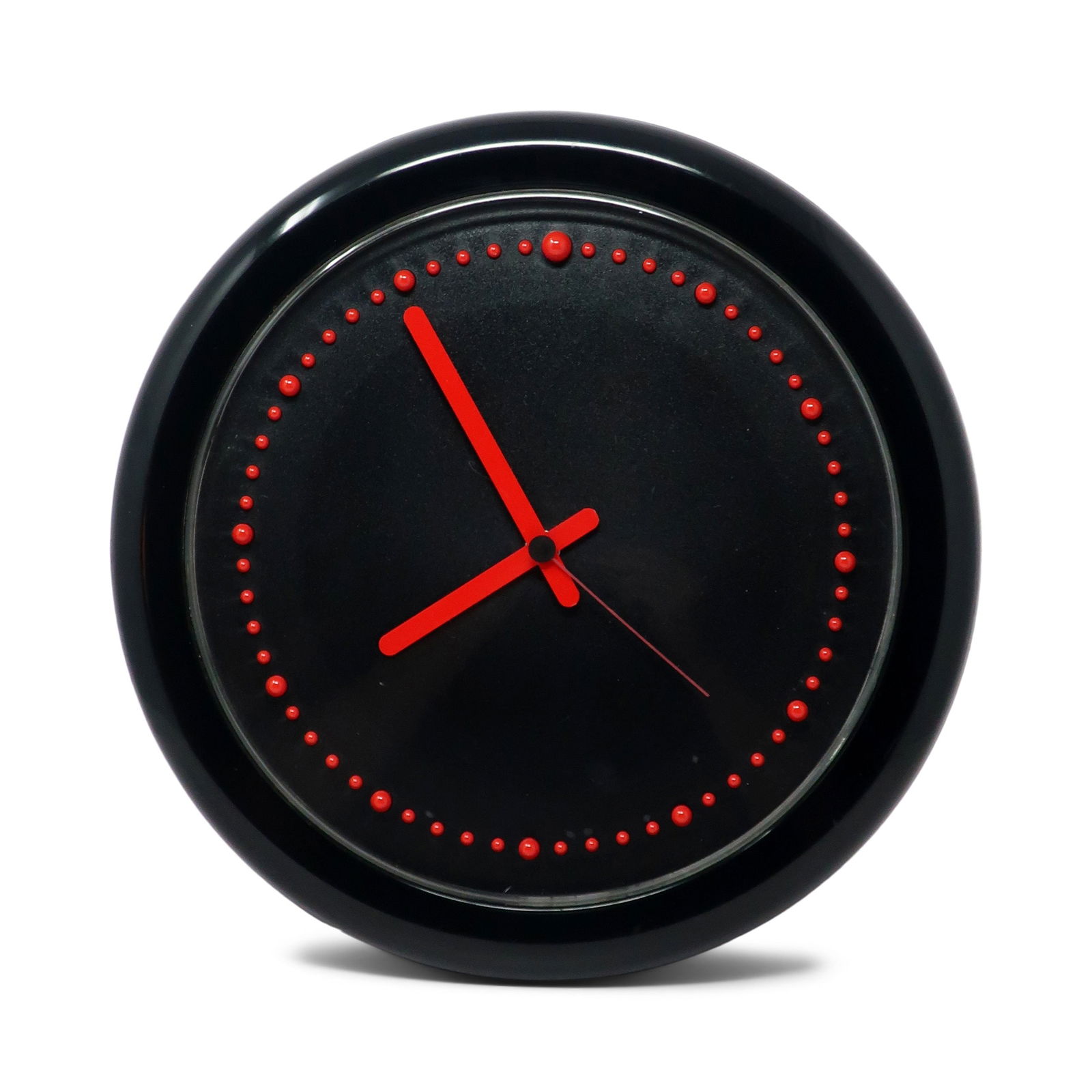 1980s Postmodern Black and Red Rexite Zero 980 Wall Clock: Designed by Raul Barbieri and Giorgio Marianelli for Rexite in 1981, this Zero 980 wall clock has a striking black and red combination. Black plastic case, REd hands, and raised red plastic bumps for