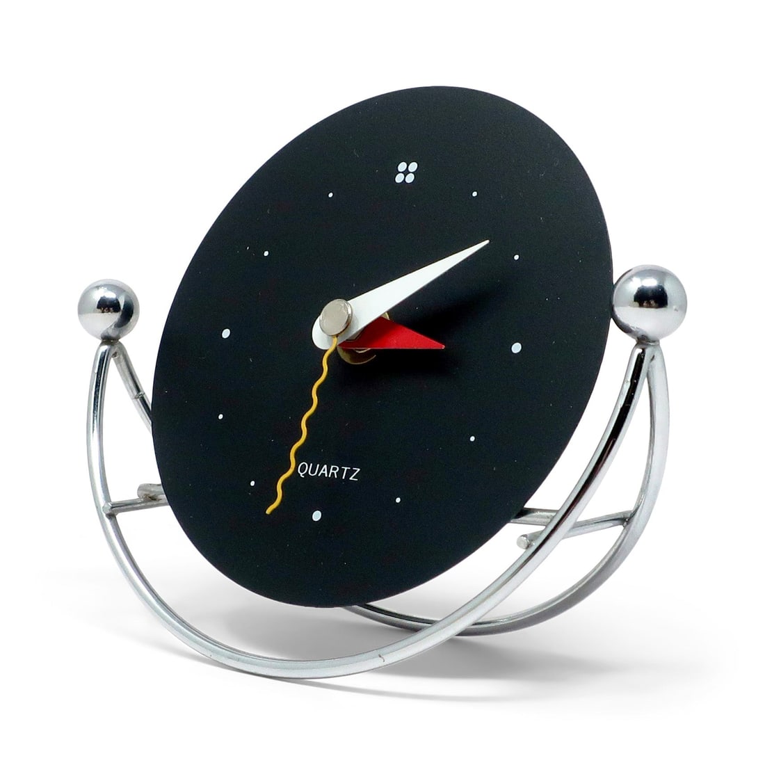 1980s Postmodern Chrome Rocking Desk Clock: A fantastic postmodern vintage desk, mantel, or shelf clock in the style of Shohei Mihara's designs for Wakita. With a black face, red, white and yellow hands, and chrome rocking base, it has the perf