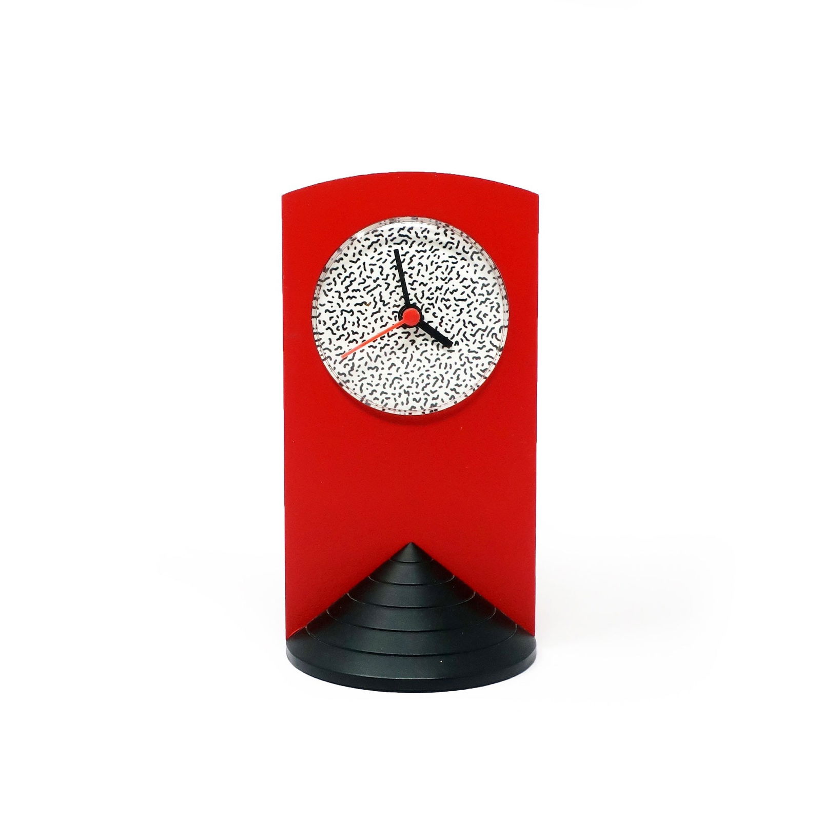 1980s Memphis Style Red Triangle Base Desk Clock: A perfectly designed 1980s Memphis Milano-inspired desk clock with a black triangular base, red plastic case, and black and white squiggle face. Looks like it could've been designed by Ettore Sottsass