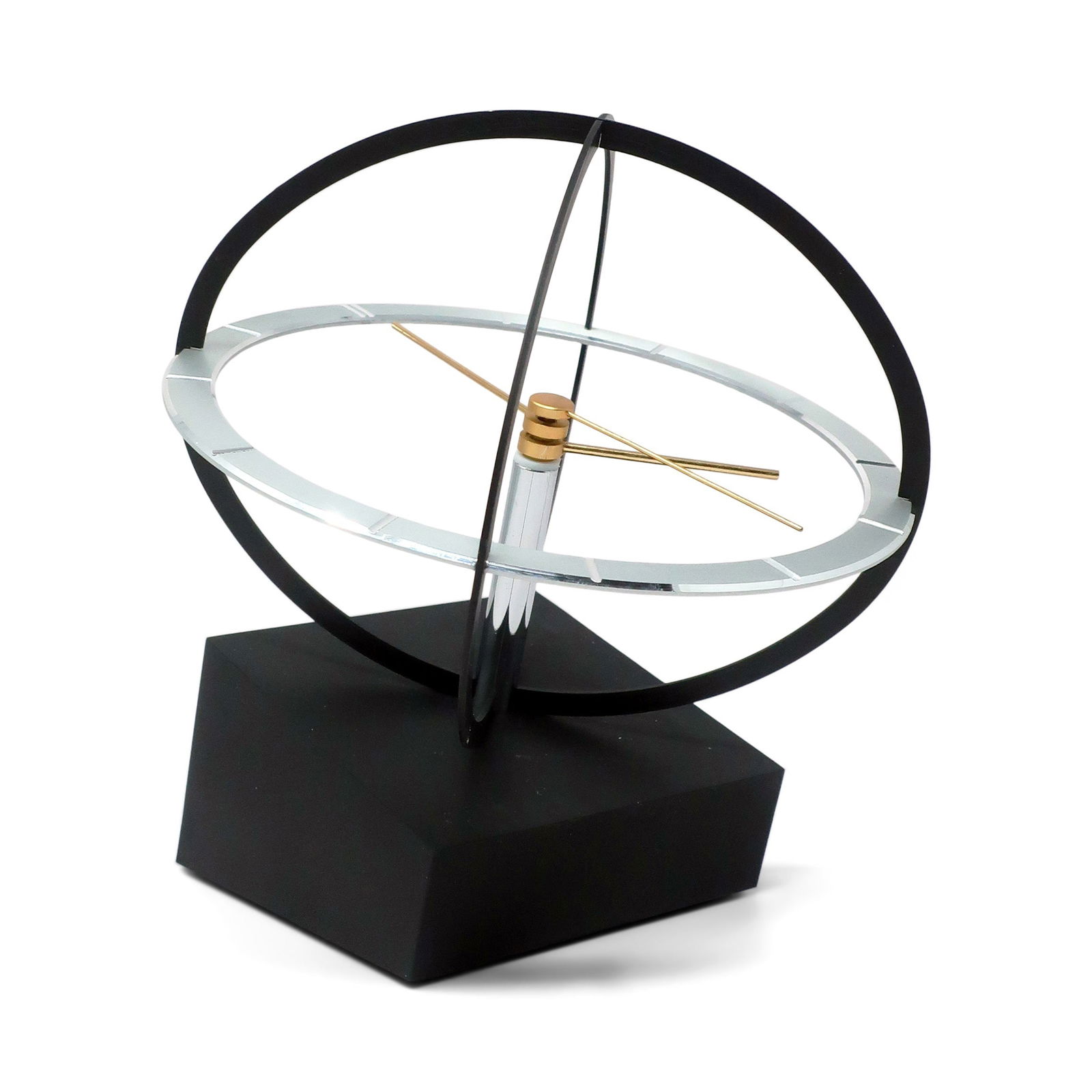 1980s Space Age Kinetic Desk Clock: Bringing a touch of Space Age design flair to your space, this mid-century clock features a kinetic sphere design, with the clock's hands rotating within the chrome frame. This clock was made or licen