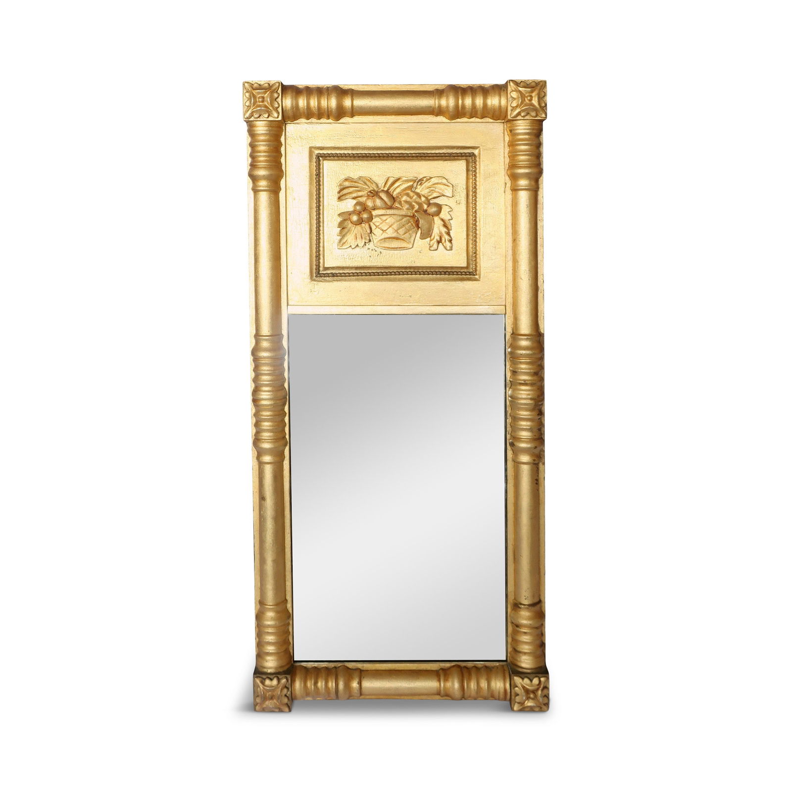 19th Century Giltwood Mirror with Rosette Corners and Fruit Panel: Vintage from the 1960s An antique carved giltwood wall mirror from the 1800s featuring a rectangular frame with rosette corners and a basket of fruit panel at the top. It is made of wood and gilded wi