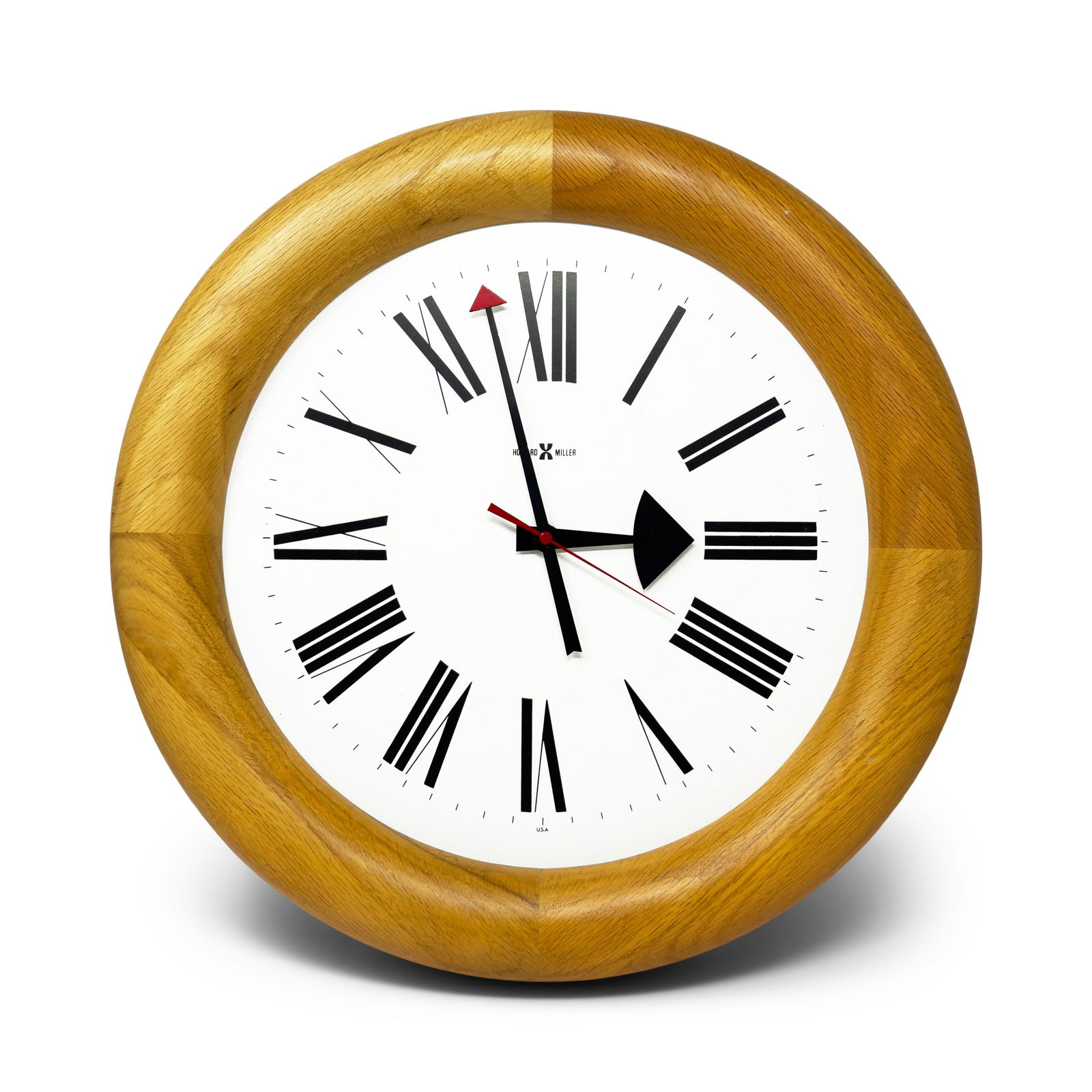 Vintage Stationmaster 611 Oak Wall Clock by Arthur Umanoff for Howard Miller: A perfectly designed mid-century modern wall clock by Arthur Umanoff for powerhouse clock maker Howard Miller. The model 611 Stationmaster has a round solid oak case, white face with black roman numer