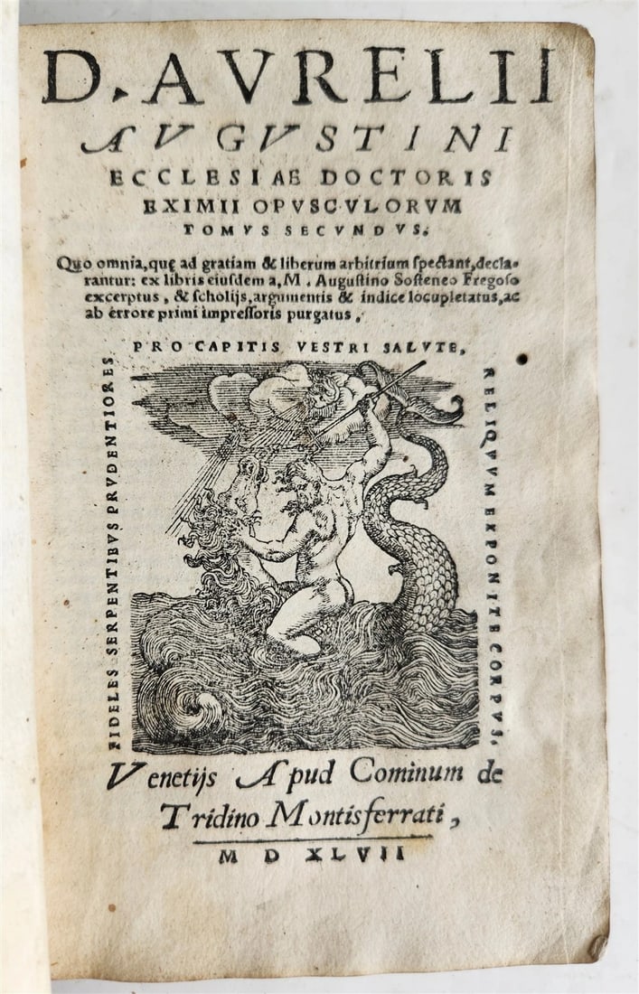 1547 OPUSCULORUM by D. Aurelii Augustini antique ILLUSTRATED vellum bound 16th C: D. Aurelii Augustini Opusculorum. Venice, Comin da Trino; 1547 With woodcut printer's mark at the title. 20 leaves, 500 pp., 2 (1 blank) leaves. Original limp vellum binding , manuscript spine title.