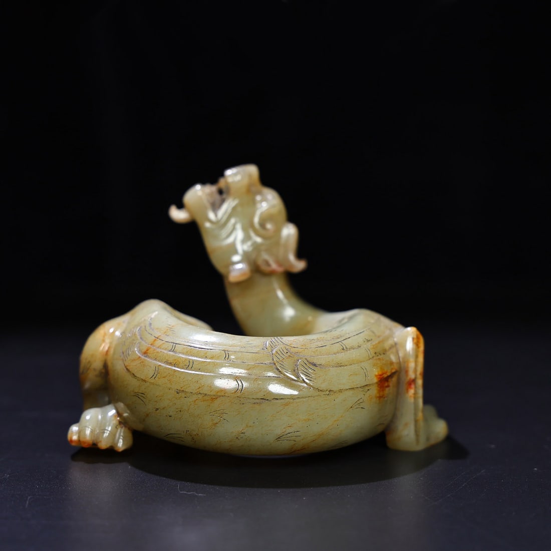 Old Chinese Hetian Jade Dragon Statue: Title: Old Chinese Hetian Jade Dragon Statue Date/Period: After1800 Origin: Chinese Dimension: 101x125x85(mm) 3.98x4.92x3.35(inches) Weight 1.41 lbs/638g Materials: Hetian Jade Reserve: $2,399.00 Ship