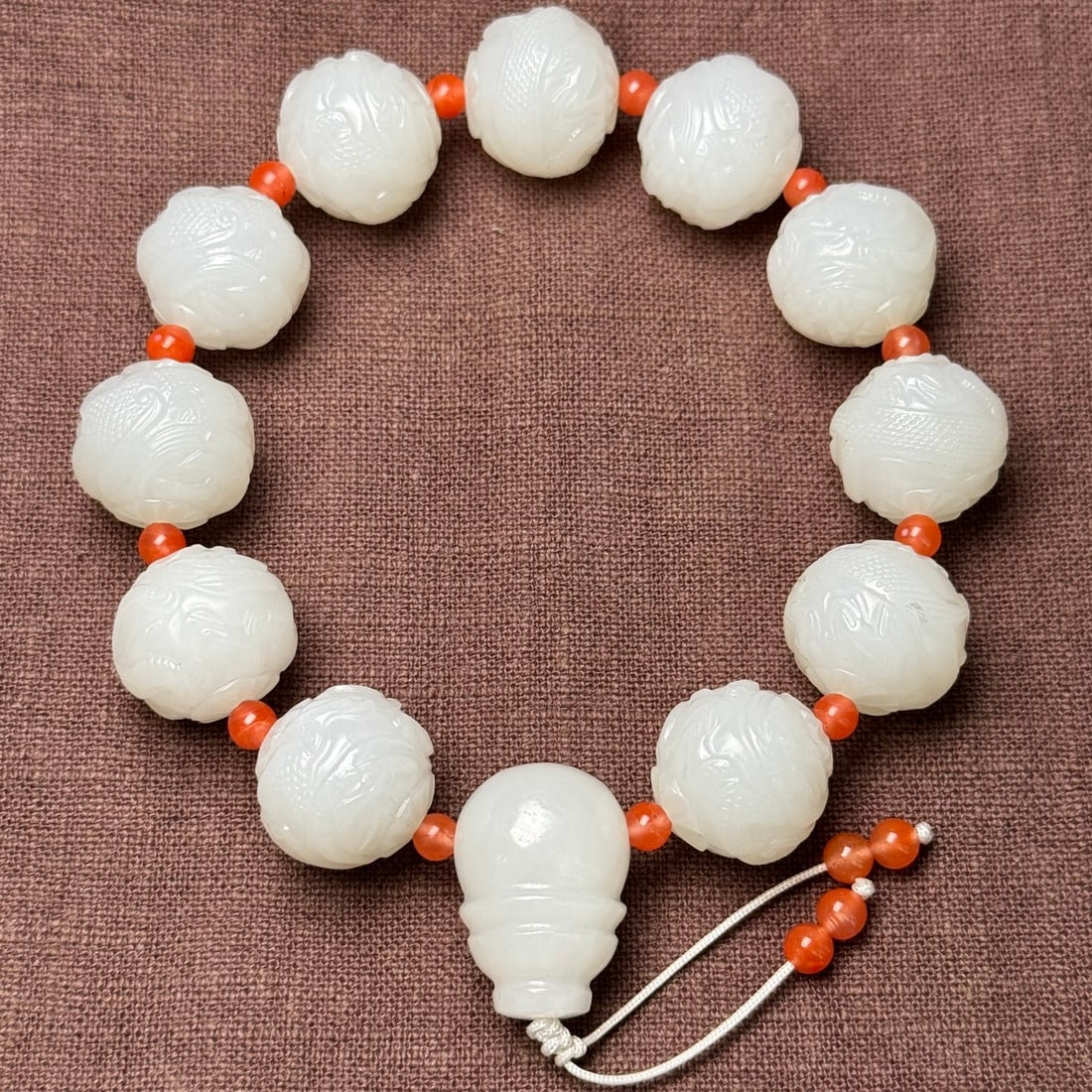 Superb Chinese White Hetian Jade Carved Fortune Dragon Beads Bracelet: Title: Superb Chinese White Hetian Jade Carved Fortune Dragon Beads Bracelet Date/Period: After2000 Origin: Chinese Dimension: 18 x 17 (mm)0.71 x 0.67 (inches) Weight: 0.22 lbs/ 100 g Materials: Hetia