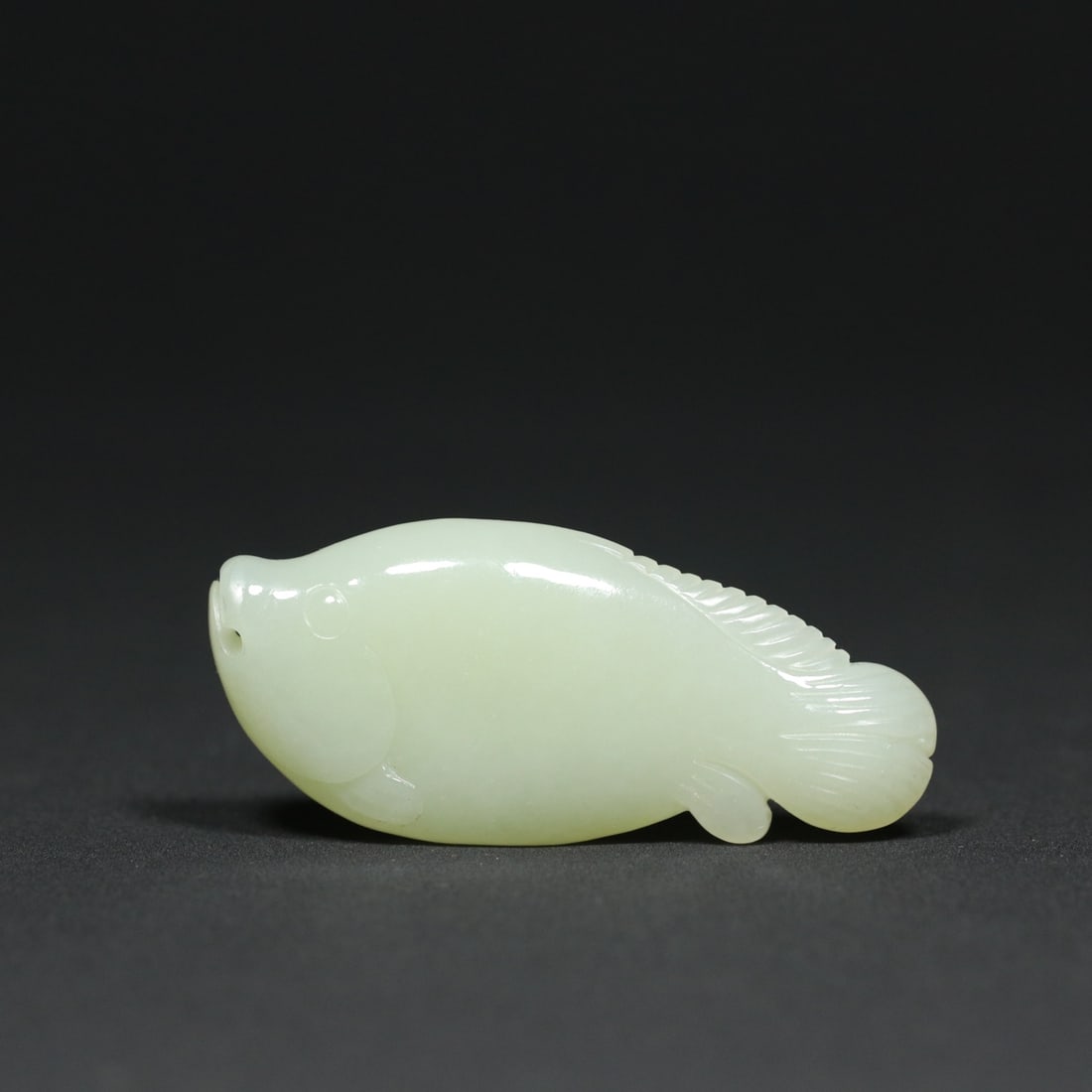 Chinese Hetian Jade Fish Pendant: Title: Chinese Hetian Jade Fish Pendant Date/Period: After2000 Origin: Chinese Dimension: 66x29x12(mm) 2.60x1.14x0.47(inches) Weight 0.07 lbs/33.5g Materials: Hetian Jade Reserve: $150.00 Shipping: