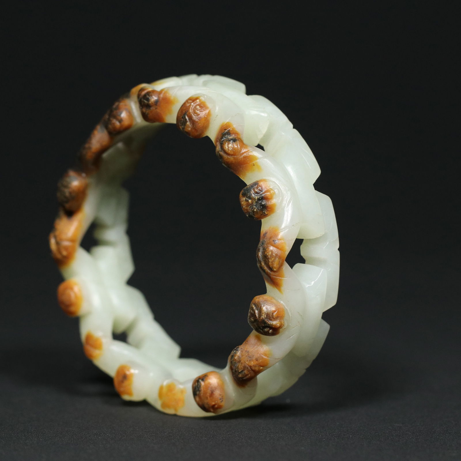 Openwork Chinese Hetian Jade Bracelet: Title: Openwork Chinese Hetian Jade Bracelet Date/Period: After1820 Origin: Chinese Dimension: 57x74x21(mm) 2.24x2.91x0.83(inches) Weight 0.14 lbs/64g Materials: Hetian Jade Reserve: $1,999.00 Shippin