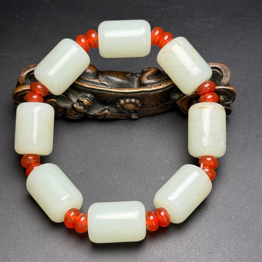 Chinese Hetian Jade Hand Chain: Title: Chinese Hetian Jade Hand Chain Date/Period: After2000 Origin: Chinese Dimension: 16x23(mm) 0.63x0.91(inches) Weight 0.23 lbs/105g Materials: Hetian Jade Reserve: $338.00 Shipping: Domestic: