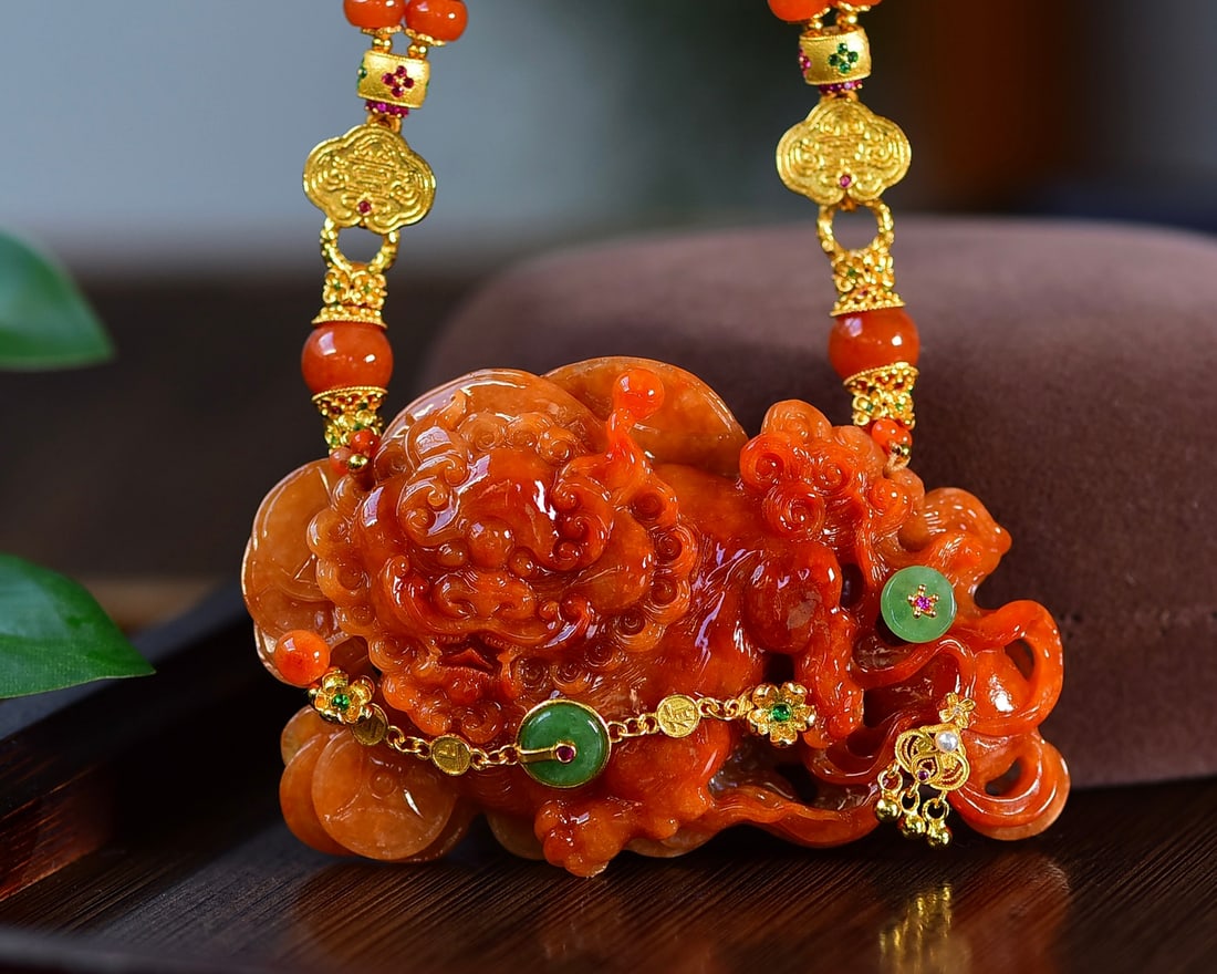 Hand-carved Natural Red Jadeite Lion Pendant with Certificate: Title: Hand-carved Natural Red Jadeite Lion Pendant with Certificate Date/Period: After2025 Origin: Chinese Dimension: 74.2x45.6x12.8(mm) 2.92x1.80x0.50(inches) Materials: Red Jadeite Reserve: $1,088.