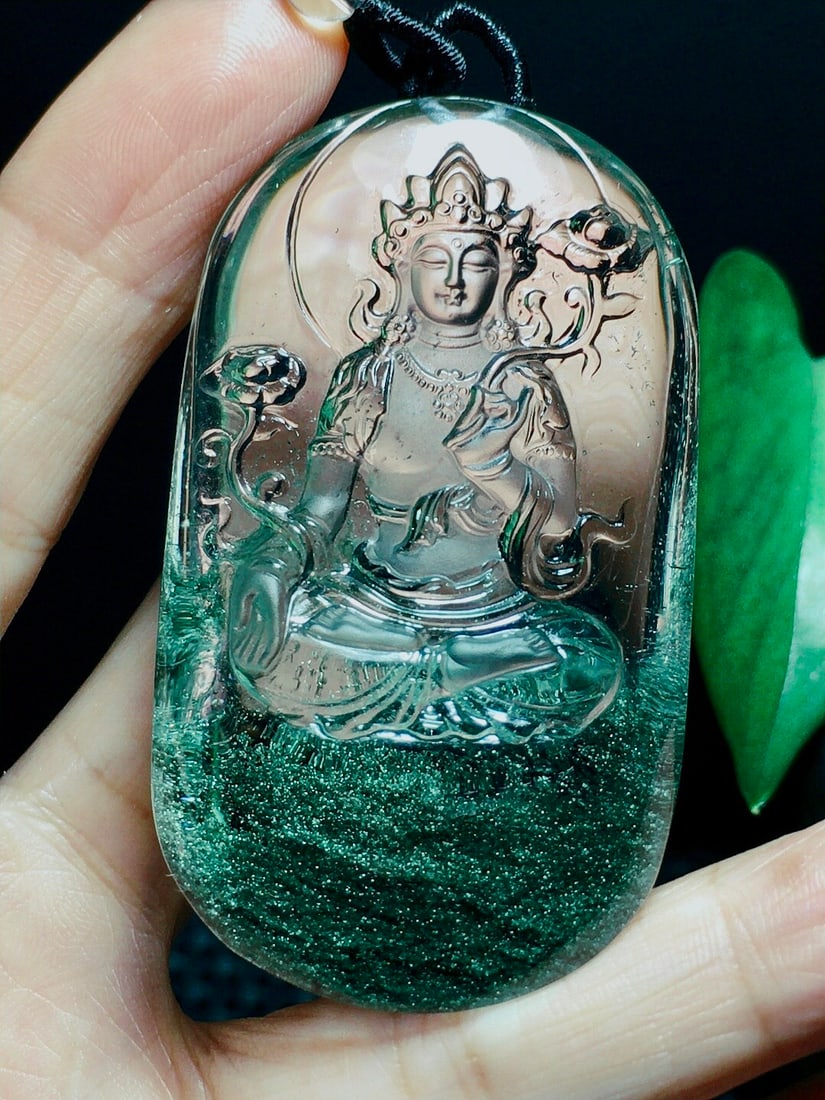 Green Crystal Kwan-yin Pendant with Certificate: Title: Green Crystal Kwan-yin Pendant with Certificate Date/Period: After2025 Origin: Chinese Dimension: 59x35x20(mm) 2.32x1.38x0.79(inches) Weight 0.14 lbs/62g Materials: Crystal Reserve: $1,399.00