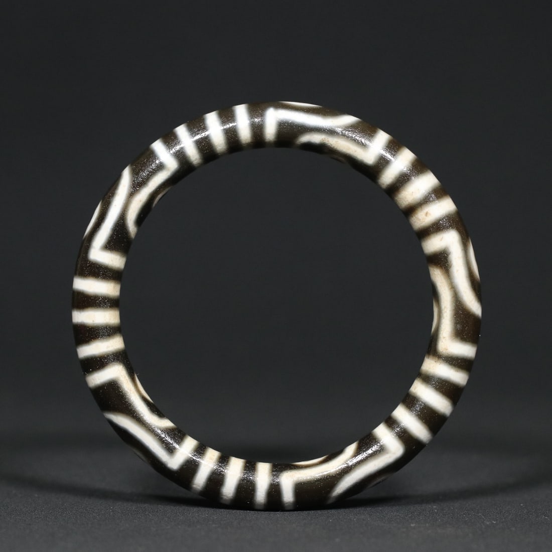 Inside Diameter 58mm Tibetan DZI Agate Bracelet: Title: Inside Diameter 58mm Tibetan DZI Agate Bracelet Date/Period: After1900 Origin: Chinese Dimension: 58x75x10(mm) 2.28x2.95x0.39(inches) Weight 0.08 lbs/35.8g Materials: DZI Agate Reserve: $219.00