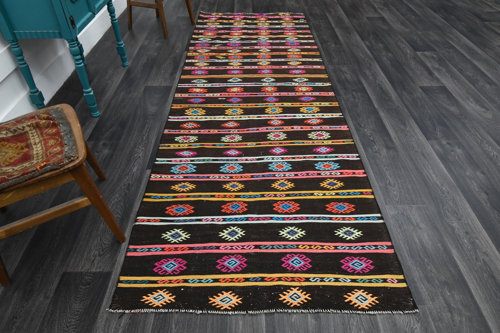 3.7x10.7 ft, Black Bohemian Kilim Rug: Title: 3.7x10.7 ft, Black Bohemian Kilim Rug Origin: Turkey Date/Period: 1960 - 1970 Materials: Wool and Cotton Size: Width: 3.7 feet Length: 10.7 feet Description: This Turkish one-of-a-kind Vintage
