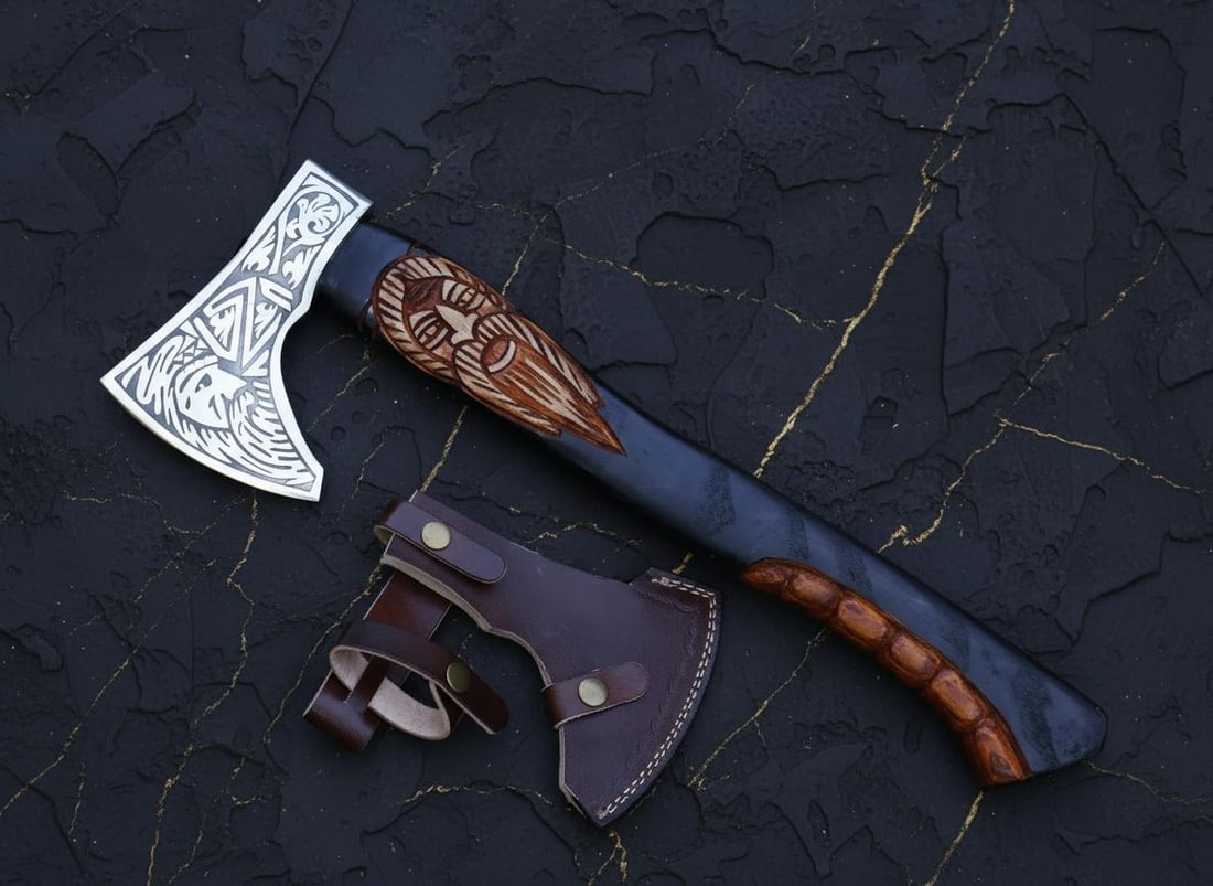 Hand Forged Carbon Steel Viking Axe with Engraved Ash Wood Handle & Sheath: Title:Hand Forged Carbon Steel Viking Axe with Engraved Ash Wood Handle & Sheath Description:This listing is for a custom hand-forged Viking-style axe, featuring a carbon steel head with decorative et