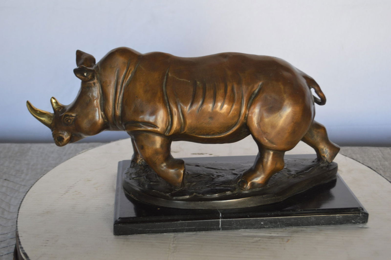 Rhino Bronze Statue Mounted on a Marble Base – Size: 21"L x 9"W x 10"H.: Title:Rhino Bronze Statue Mounted on a Marble Base – Size: 21"L x 9"W x 10"H. Description:Rhino Bronze Statue Mounted on a Marble Base – Size: 21"L x 9"W x 10"H. Details:SKU: RhinoBronzeStatueMoun