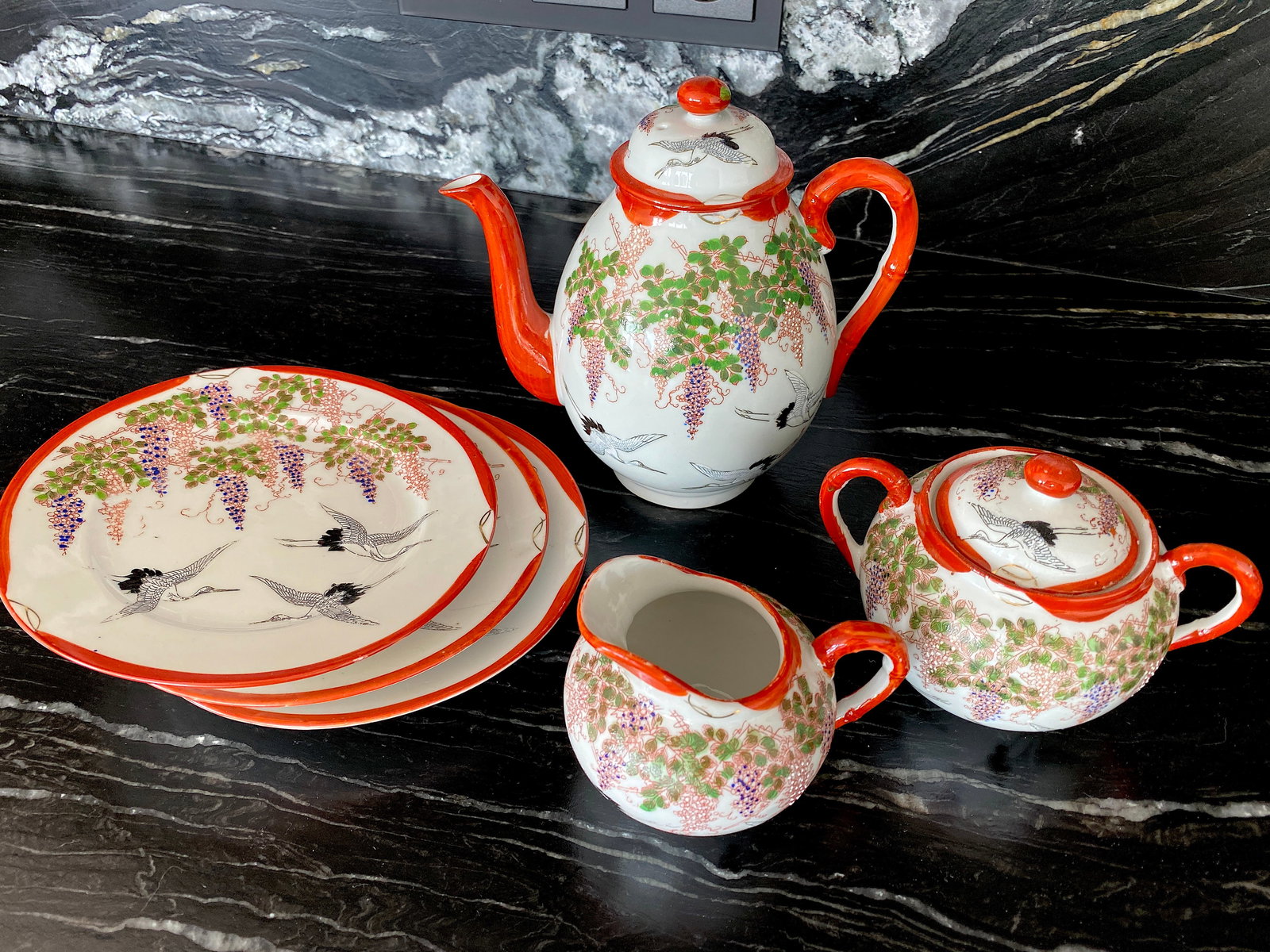 Antique Handpainted Japanease tea set: Title: Antique Handpainted Japanease tea set Maker:Unknown Origin: Unknown Date/Period:Unknown Materials:Porcelain Size:170.0 mm Diameter platesTeapot: 180 x 170 x 115 mmSugar cup: 137.5 x 100 x 92.5