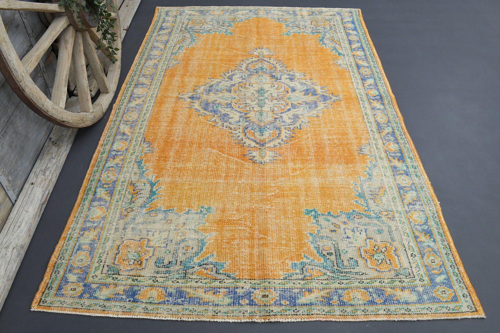 5.7x8.5 TURKISH RUG, Distressed Orange Boho Chic Décor: Title: 5.7x8.5 TURKISH RUG, Distressed Orange Boho Chic Décor Origin: Turkey Date/Period: 1960 - 1970 Materials: Wool And Cotton Size: Width: 5.7 feet Length: 8.5 feet Description: This Turkish o