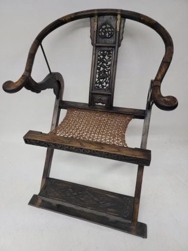 Antique Chinese Huanghuali Horseshoe Folding Throne Chair: Title: Antique Chinese Huanghuali Horseshoe Folding Throne Chair Description: Materials: elmwood, wood, brass, metal, bronze Overall width: 28.5 inches Overall height: 42 inches Overall depth: 30