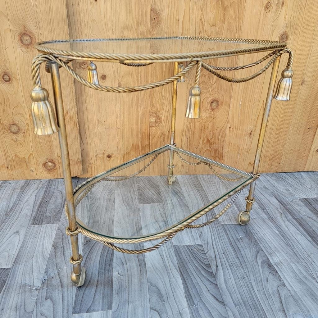 Hollywood Regency Italian Gilt Rope & Tassle Drinks Trolley Bar Cart: Title: Hollywood Regency Italian Gilt Rope & Tassle Drinks Trolley Bar Cart Description: Materials: gilt, metal, glass Vintage Hollywood Regency Italian Gilt Rope & Tassle Drinks Trolley Bar Cart This