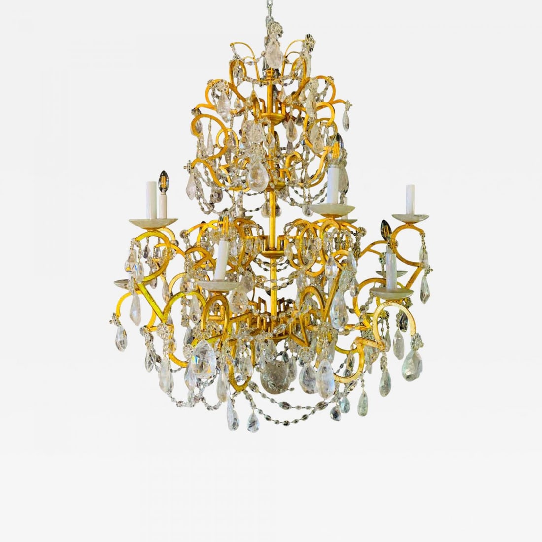 12 Light Gilt Metal Rock Crystal Chandelier. Hollywood Regency in Style.: Title: 12 Light Gilt Metal Rock Crystal Chandelier. Hollywood Regency in Style. Description: 12 Light Gilt Metal Chandelier Having Multiple Rock Crystal Prisms in the Hollywood Regency Style. This