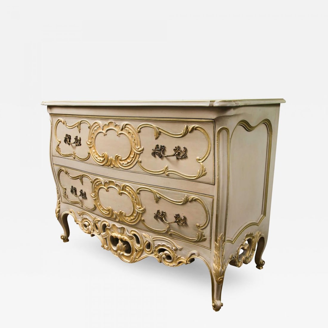French Bombe Commode Creme Peinte And Parcel Gilt: Title: French Bombe Commode Creme Peinte And Parcel Gilt Description: French bombe commode, creme peinte and parcel-gilt, the shaped top over a conforming case fitted with two large drawers, oak