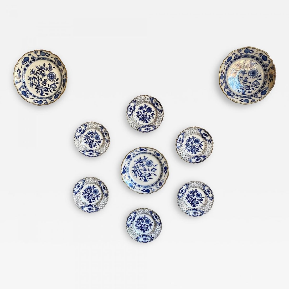 Nine Blue Onion Meissen Show or Wall Plates: Title: Nine Blue Onion Meissen Show or Wall Plates Description: Nine blue onion Meissen show or wall plates. This is a stunning collection of blue white wall platters purchased from a NYC Socialite