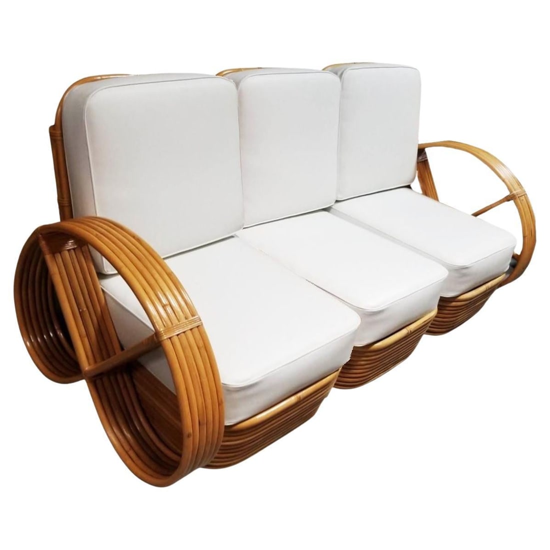 Restored Rattan Six-Strand Three Piece Full Pretzel Sofa w/ Stacked Base: Title: Restored Rattan Six-Strand Three Piece Full Pretzel Sofa w/ Stacked Base Description: This beautifully restored Paul Frankl-inspired Mid-Century Era Rattan 3-piece sofa with full pretzel six-st