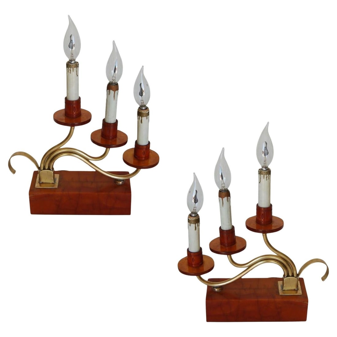 Pair of Hollywood Regency Three Candle Bakelite and Brass Table Lamps: Title: Pair of Hollywood Regency Three Candle Bakelite and Brass Table Lamps Description: Pair of ornate three candelabra Bakelite and brass table lamps in caramel/butterscotch color. Measures: 12"