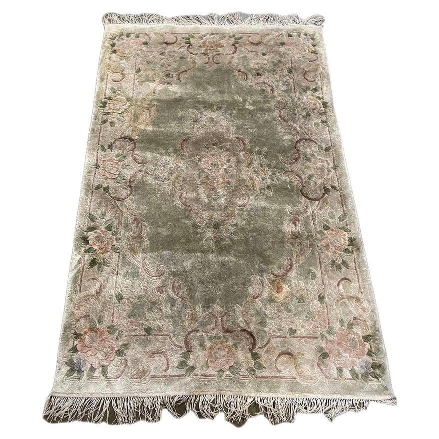 5.5' x 3.5' Deep Pile Taupe/ Green Floral Nepalese Wool/Cotton Area Rug: Title: 5.5' x 3.5' Deep Pile Taupe/ Green Floral Nepalese Wool/Cotton Area Rug Description: Large Wool on cotton Taupe/ Green Floral Nepalese area rug with pink floral motifs throughout the entirety