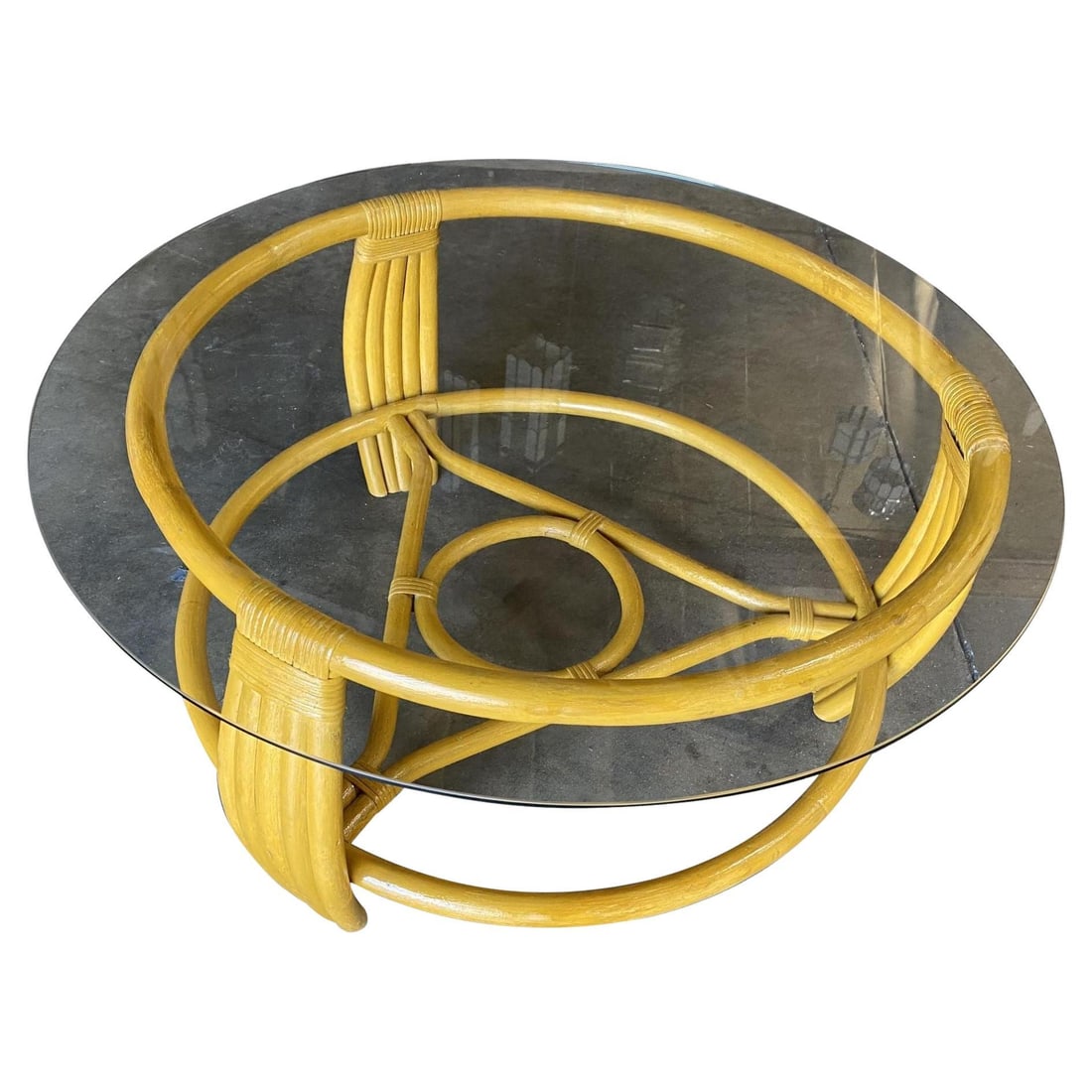 Restored Vintage Five Strand Rattan Coffee Table with Glass Top: Title: Restored Vintage Five Strand Rattan Coffee Table with Glass Top Description: Five-strand rattan coffee table, circa 1940. The unusual round base's circular form is echoed throughout the piece w