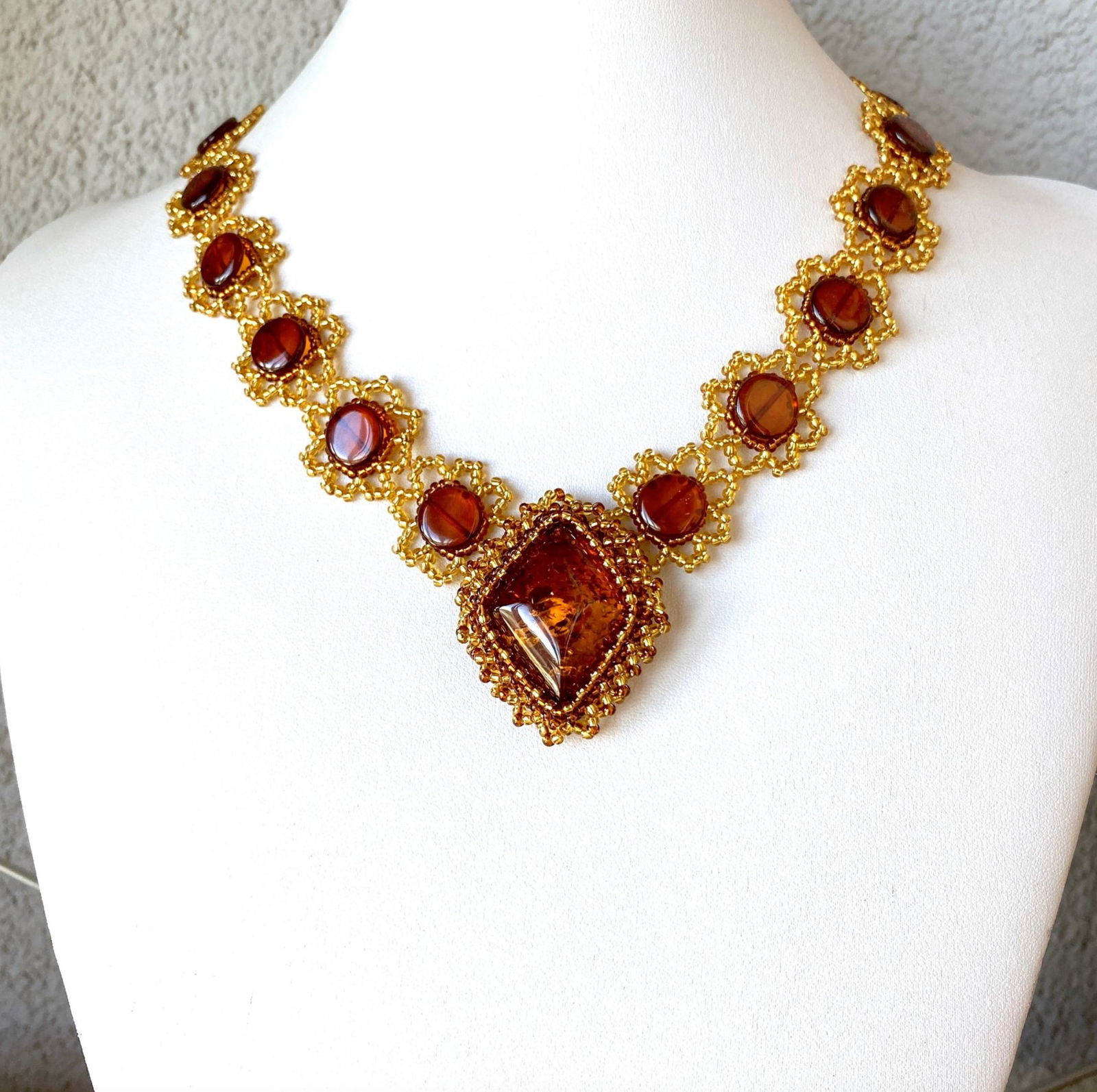 Remarkable Vintage Amber Floral Necklace made from leaf like bead ornaments: Title:Remarkable Vintage Amber Floral Necklace made from leaf like bead ornaments Metal:NoneGemstone:AmberWeight:30.0 gSize:Size: 520.0 x 42.0 x 10.0 mm Size: 20.472 x 1.654 x 0.394 inches Made