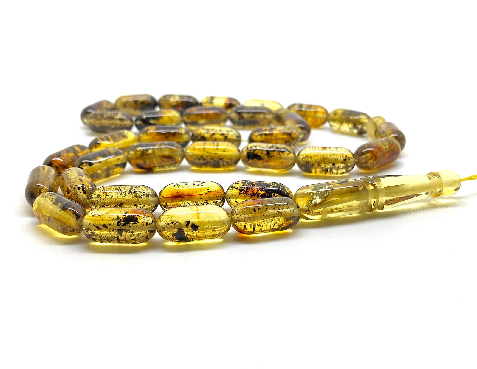 Amber Tesbih made from Barrel tablet shaped Amber beads: Title:Amber Tesbih made from Barrel tablet shaped Amber beadsMetal:NoneGemstone:AmberWeight:25.9 gSize:Bead size: 16.0 x 8.0 mm Bead size: 0.63 x 0.315 inches Made of:(Reconstituted Amber or Whole