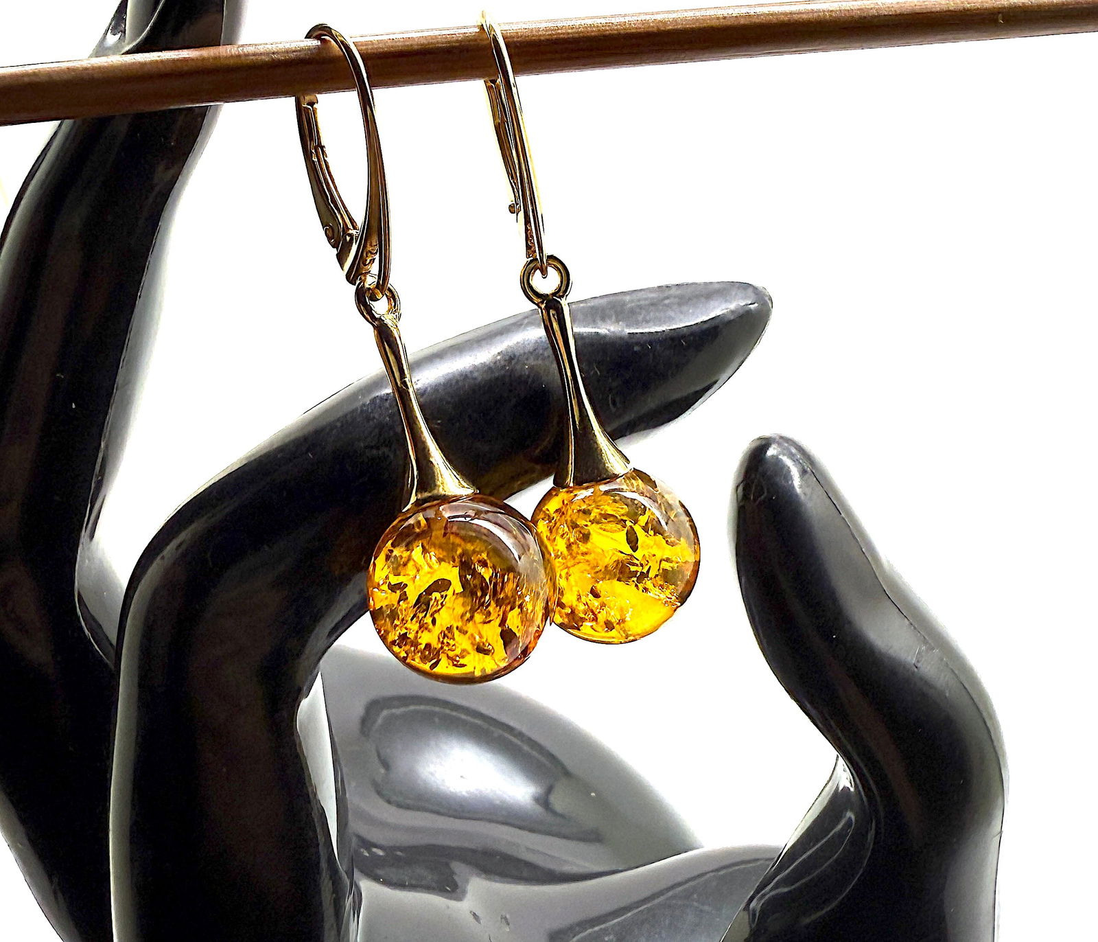 Astonishing Amber Earrings: Title:Astonishing Amber Earrings Metal:925 Silver-Gold Plated Gemstone:Amber Weight:4.4 g Size:Size: 12.0 x 12.0 x 40.0 mm Size: 0.472 x 0.472 x 1.575 inches Made of:(Reconstituted Amber or Whole Ston