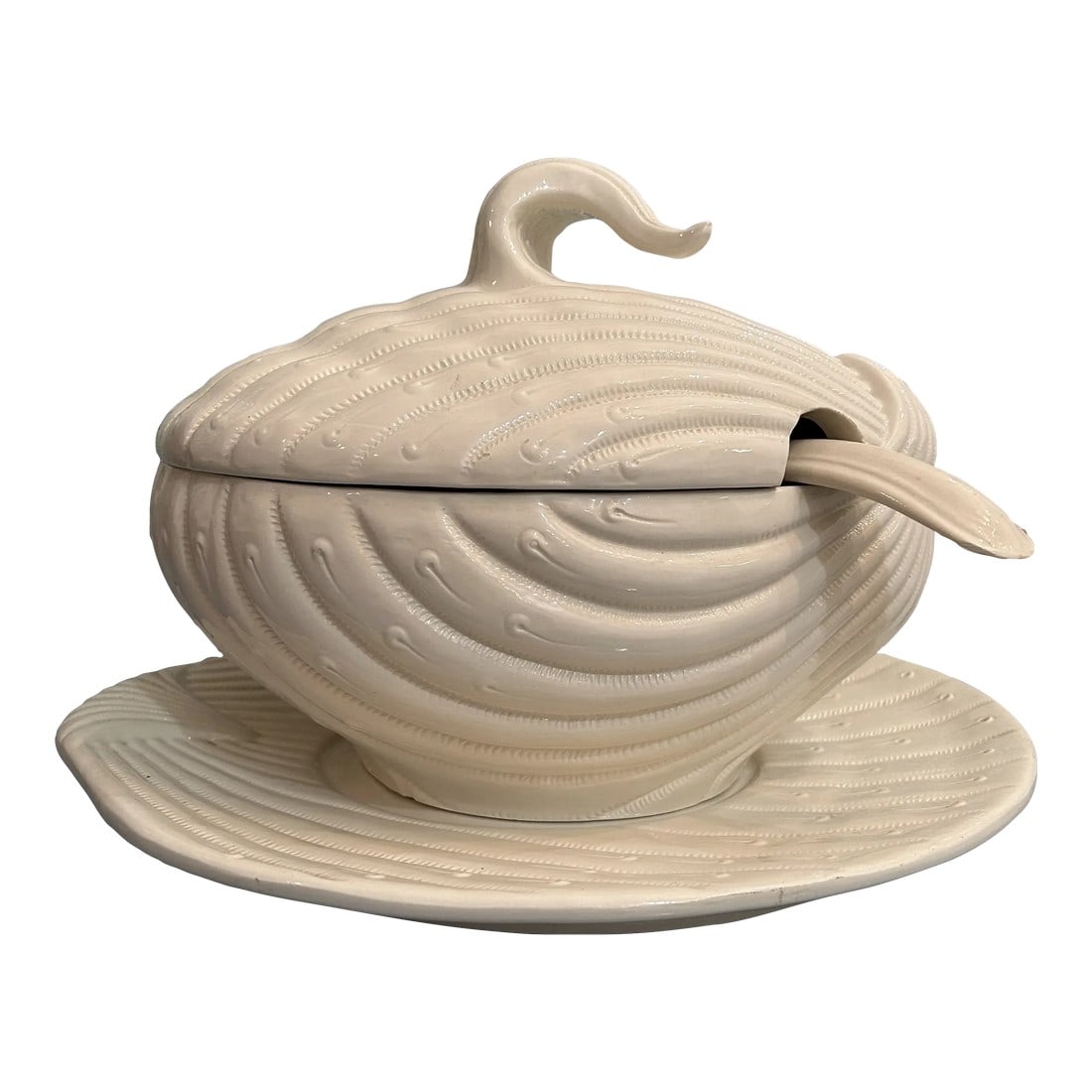 Late 20th Century Italian Ceramic Clam Shell Tureen With Ladle and Underplate: This large tureen is a stylized version of a clam shell and is so perfect for coastal or Palm Beach decor. The set includes the tureen with lid, a ladle and the underplate. The clam shell motif is acc