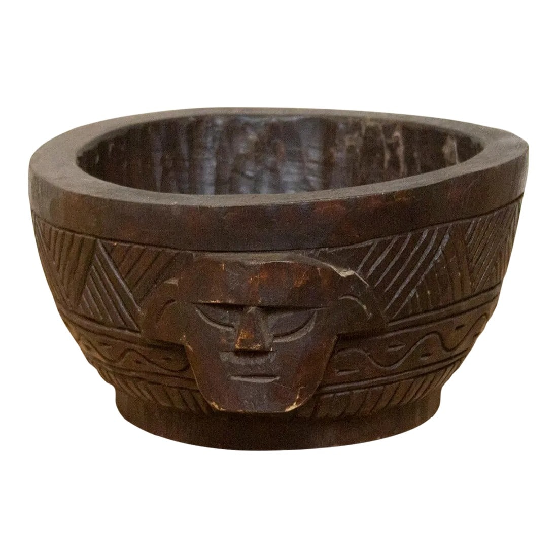 Hand-Carved Ao Naga Kitchen Bowl: This primitive vintage hand-carved pot is a remarkable artifact from the tribes of Nagaland. This unique vessel carved from a single log of wood showcases intricate geometric tribal designs, and on