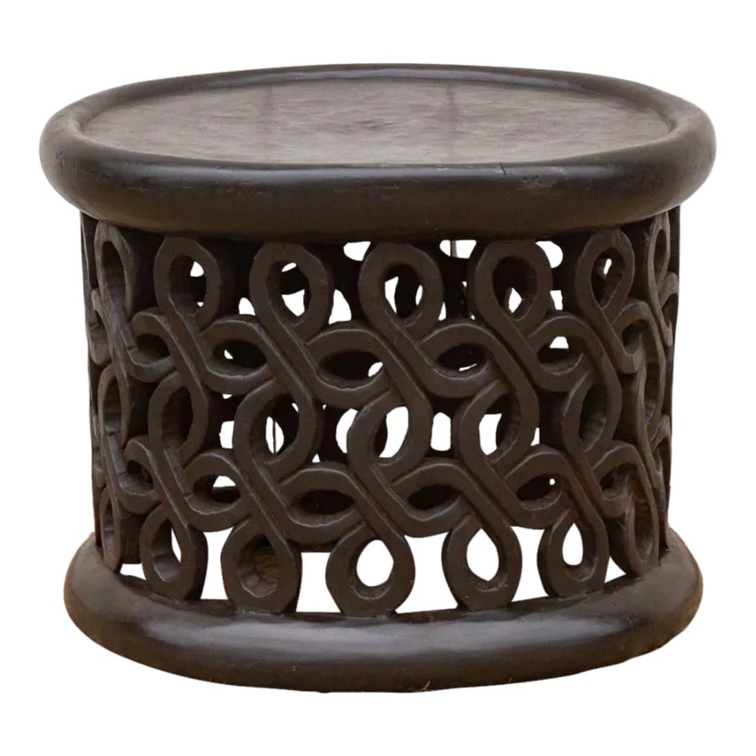 African Floral Carved End Table: This extraordinary Bamileke table, an exceptional piece carved from a single tree trunk. This African coffee table is inspired from the traditional chief stool, possess an exquisite display of
