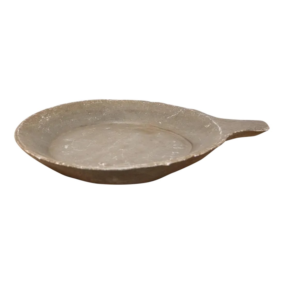 Large Stone Parat Bowl: An antique Indian parat stone bowl, a relic from the past cherished for its practicality and rustic charm. Crafted from solid stone, this large food bowl boasts an aged natural hue, speaking volumes