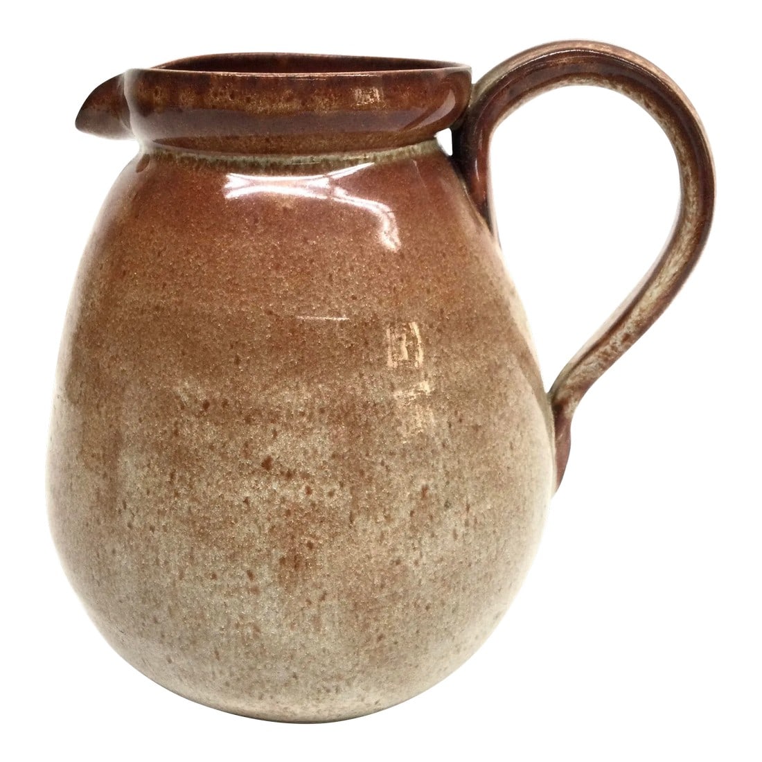 Artisan Ceramic Glazed Fired Water Pitcher: What an unusual glaze on this piece. The subtle colors of cinnamon and pale celery green will bring light and relaxing vibes to your space. Fill this vessel with water or wine. The handle is easy on