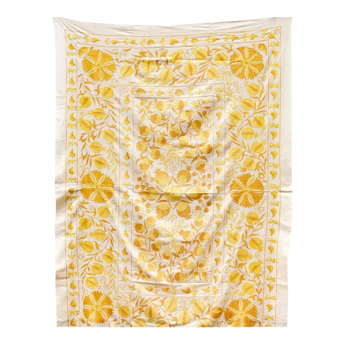 Melina Golden Yellow Suzani Throw: This beautiful vintage Suzani tapestry originally handcrafted in Uzbekistan is full of history, luxury, and style. The yellow suzani motif is hand embroidered using silk to feature botanical designs