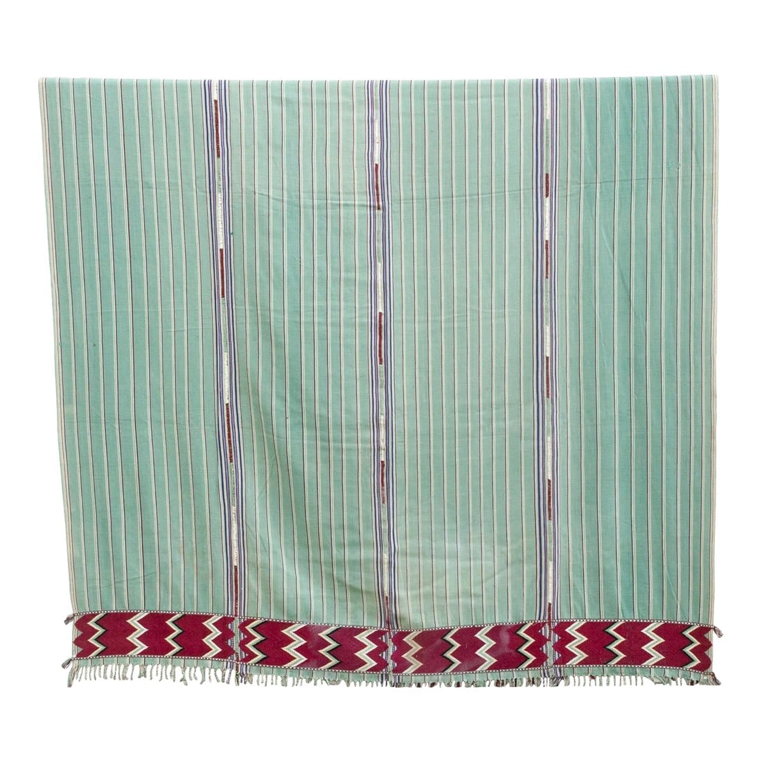 Mid-Century Sea Foam Green Mayan Coverlet: This beautiful vintage bedcover whispers stories from the Guatemala highlands. Handwoven on a traditional back-strap loom, the cool cotton base, perfect for the Guatemalan climate, is bathed in a