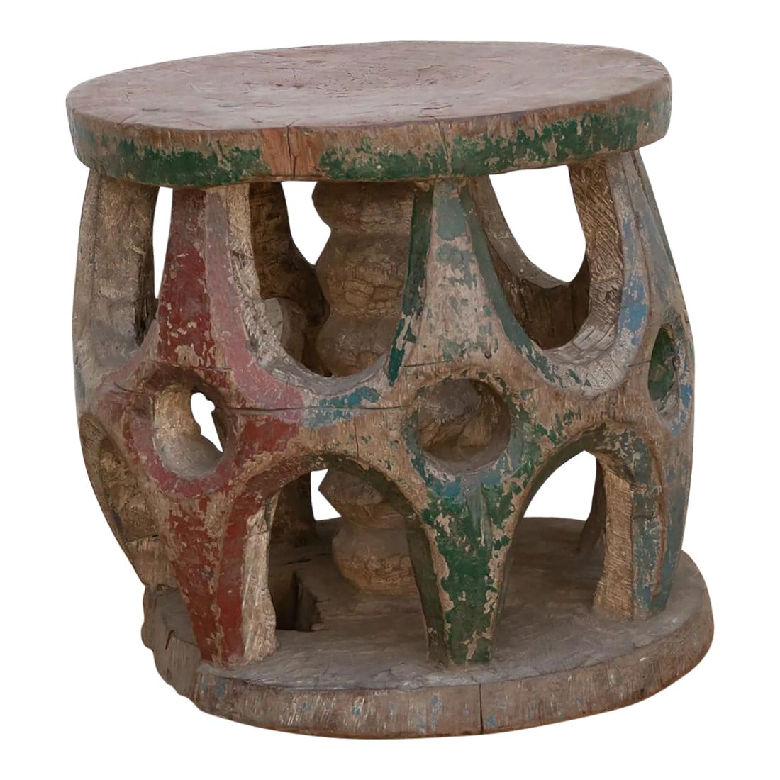 Antique West African Ceremonial Stool: A piece of history, this antique African Bamileke stool was originally used as a ceremonial seat to signify the status and power of tribal chiefs and kings. Hand-carved from a single wood log with